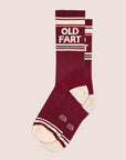 A pair of dark red socks with ivory details and text at the top that reads, "Old Fart".