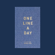 A blue denim journal with neutral text on the front that reads, 'One Line A Day A Five-Year Memory Book'.