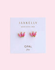 A pair of pink crown shaped stud earrings made of pink opal stones.