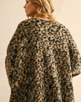 A tan and black leopard print cardigan.