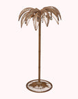 A brownish bronze metal palm tree shaped floor lamp.