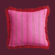 A pink and red striped pillow.