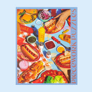 A puzzle with an image of a hot dug and burger spread.