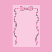 A pink notepad with bow shaped graphic on the top.