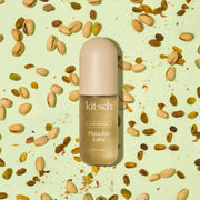 A light tan and light green bottle of hair perfume with white text that reads, 'kitsch Pistachio Latte'.