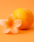 An orange flower shaped hair clip
