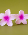 A hot pink flower shaped hair clip.