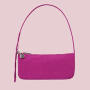 A hot pink mini shoulder bag.