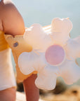 A flower shaped arm band floaty for kids.