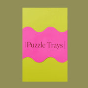A set of 6 trays in vibrant colors for sorting through puzzle pieces. Puzzle sold separately.
