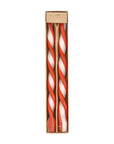 A red and white twist taper candle set of two.