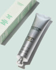 A silver tube of hand cream with black text that reads, 'Flamingo Estate Manuka Rich Cream'.