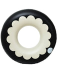 A black and white scalloped pool tube float.