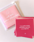 Different tones of pink cards that each have an uplifting affirmation on them for you to read and stick on the walls of your shower.
