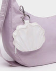 A shell shaped bag charm.