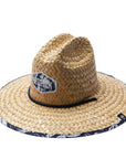 A straw sun hat with a dark blue and white desert design under the brim and a coordinating neck strap.
