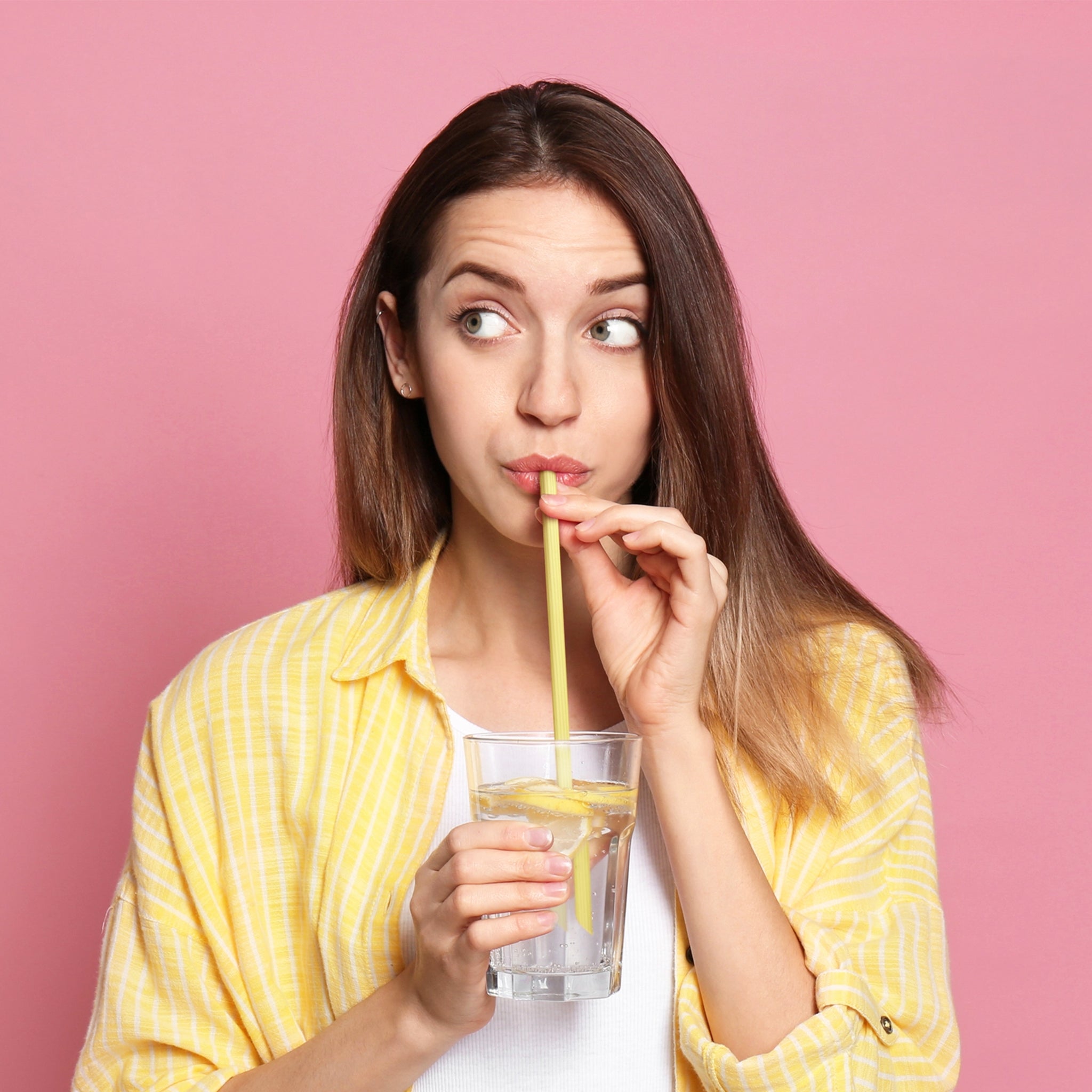 A model sipping out of one of the straws.