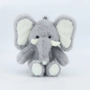 A grey baby elephant shaped stuffed animal.