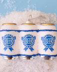 On a blue background is a glass ornament in the shape of a six pack of beers with blue labels.