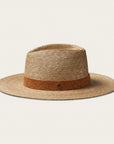 On a white background is a tan woven sun hat with a band around the base of the hat.