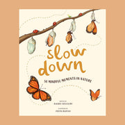 In front of a burnt orange background is the cover of a book. The cover is ivory with gold text in the middle that reads ‘slow down.’ Below is black text that reads ’50 mindful moments in nature.’ At the top of the cover is a brown branch with red lady bugs on top. Going across the bottom of the branch is the different stages of a cocoon opening up to a butterfly. There are two butterflies flying around the bottom of the book.