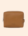 A warm brown toiletry case with a zipper closure.
