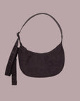A plum/chocolate brown nylon crescent shaped handbag with an adjustable strap that goes from a shoulder bag to crossbody.