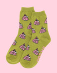 A pair of chartreuse green and pink crew socks with a Snoopy puffer jacket print.