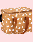 A brown and white spotted lunch box with a darker brown strap.