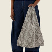 A nylon tote bag with a snakeskin print.