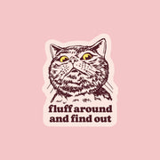 A cat sticker with text underneath that reads, 'fluff around and find out'.