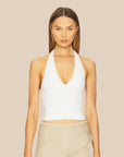An ivory open back halter tank top.