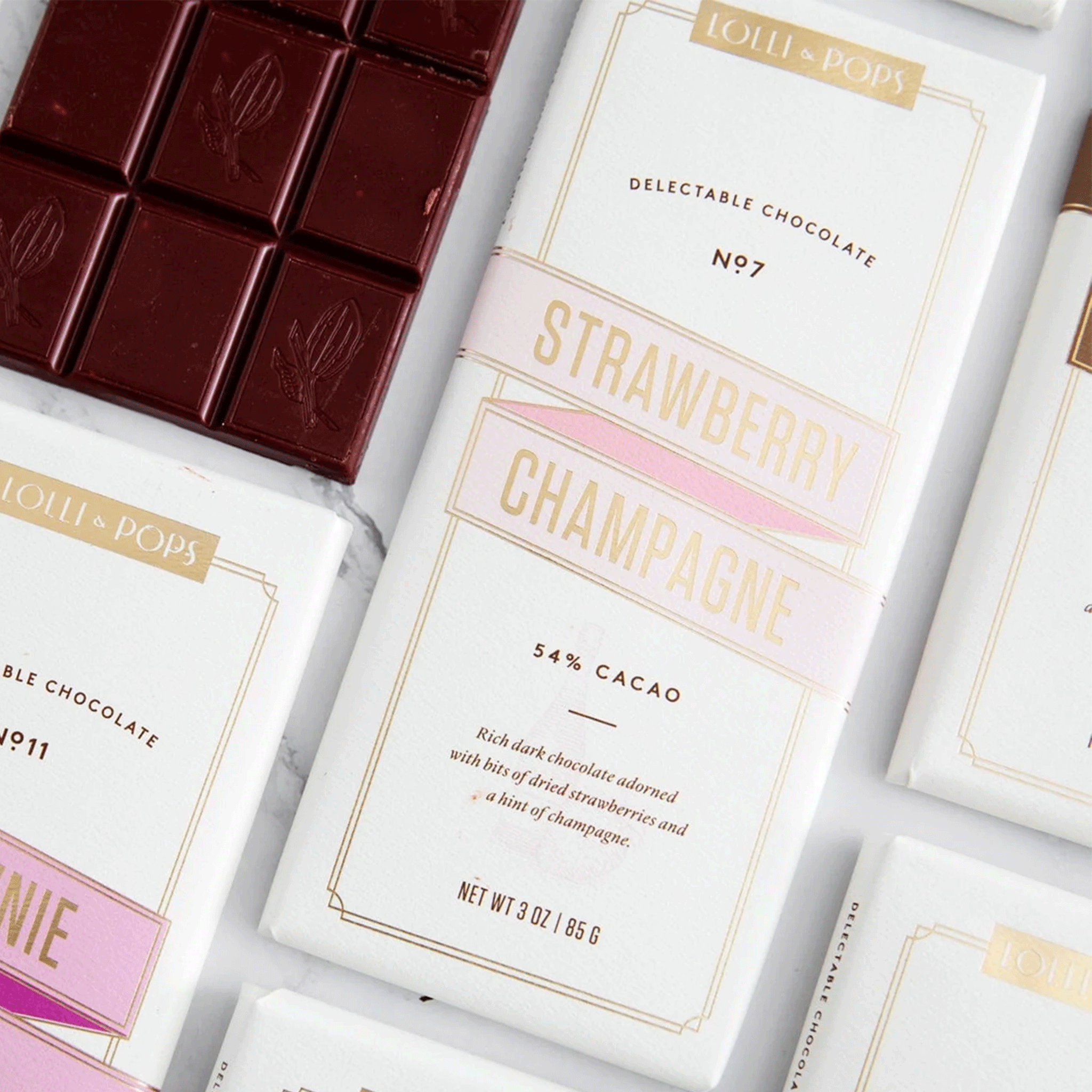 A neutral colored packaging containing a strawberry champagne flavored chocolate. 