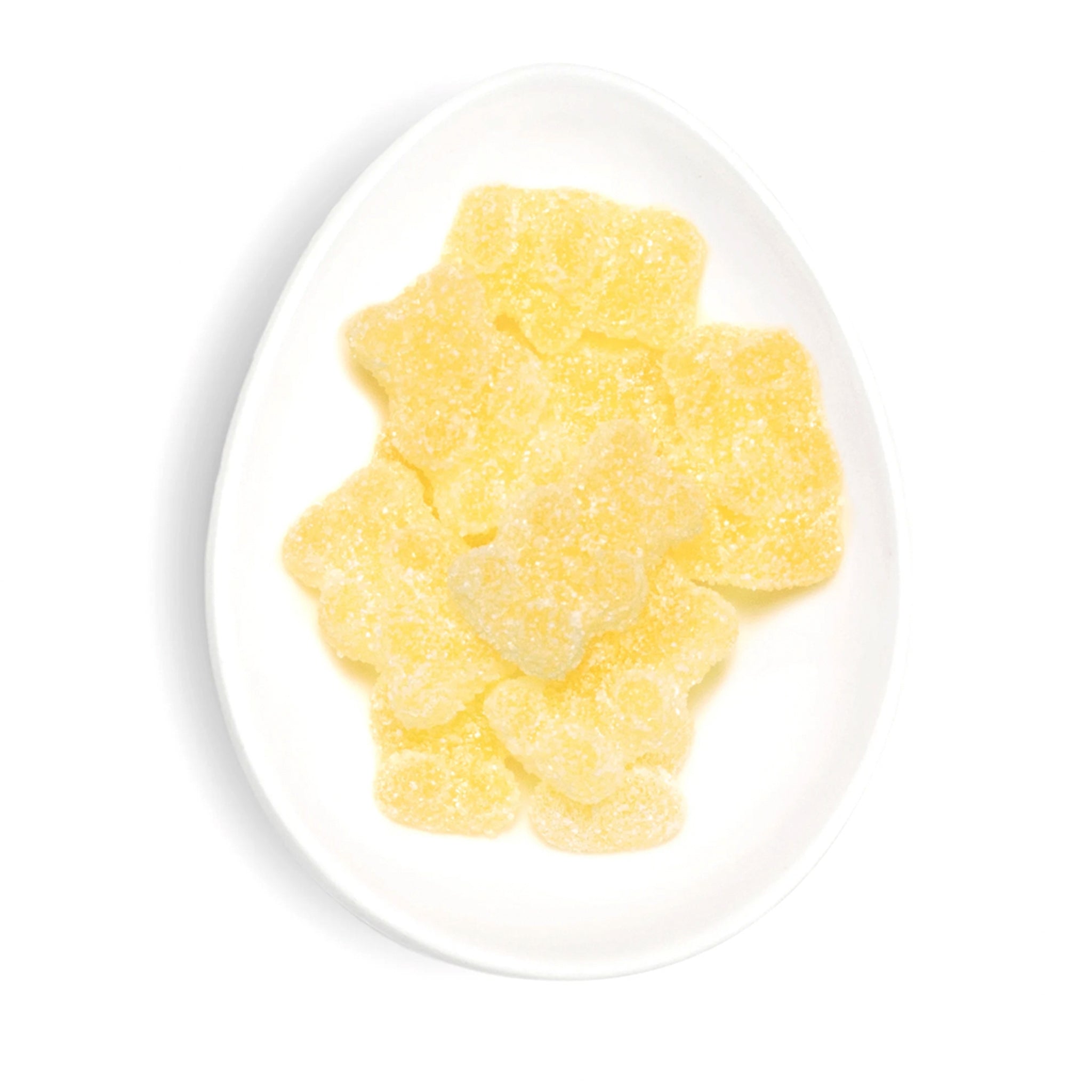 A plate of yellow lemon drop flavored gummy bears.