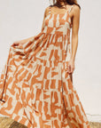 An orange and ivory geo printed maxi dress.