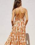 An orange and ivory geo printed maxi dress.