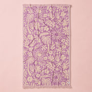 Floral patterned towel on a pink background