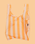 A nylon reusable bag with tangerine wide stripes.