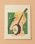 An art print of Dolly Parton signing and holding her banjo with a green background and her in pink. Frame not included.