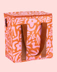 A pink and orange floral print cooler bag.