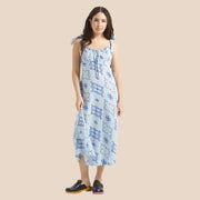 A light blue dress with dark blue tile shaped graphics.