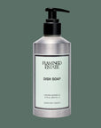 A silver bottle of dish soap with a light blue label that reads, 'Flamingo Estate Dish Soap'.