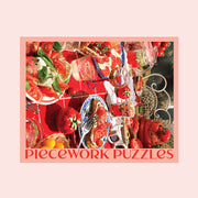 A light pink box filled with a tomato themed puzzle with beautiful red hues and imagery.