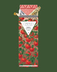 A chocolate bar with a tomato packaging and text that reads, 'Compartes Tomato Chocolate'.