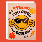 Greeting card with a smiley face on the cover. The smiley face is holding up peace signs and is wearing sunglasses. The card reads "Officially Too Cool For School".