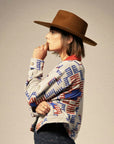 A blue and red geometric print terry cloth jacket.