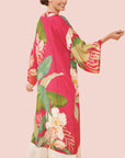 A hot pink robe with a floral pattern.