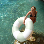 A white and mint round tube inflatable float.