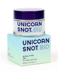 On a white background is a jar of body glitter with a blue lid and text across the front that reads, "Unicorn Snot BIO".