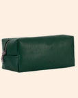 An emerald green vegan leather cosmetic case with a zipper closure.